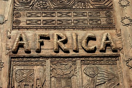 An africa sign on wood with carvings.の写真素材