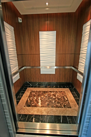 The interior of an elevator with a marble floorの写真素材