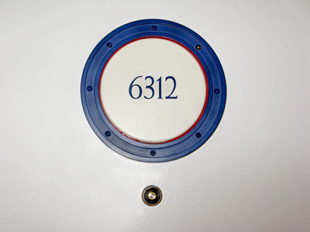 A hotel room number on a door.