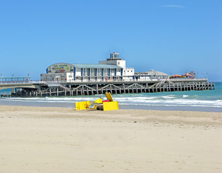 A view of a beach, sea and a pier.のeditorial素材