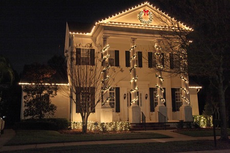 A Colonial House with a lot of Christmas Lights A Colonial House with a lot of Christmas Lights