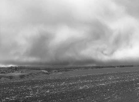 storm clouds over the fieldの写真素材