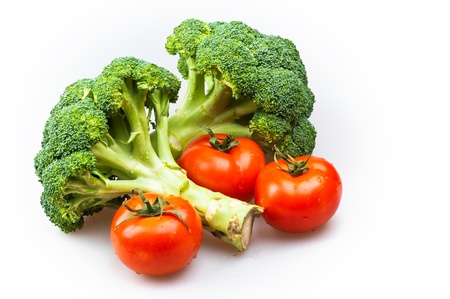broccoli and tomatoes isolated on white backgroundの写真素材