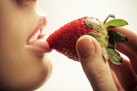 sensual mouth and strawberryの写真素材