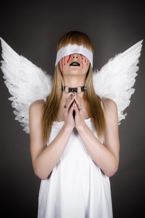 fallen angel prayingの写真素材