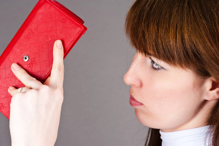 woman with displeasure looks purse