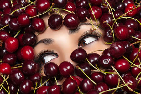 brown eyes woman in cherryの写真素材