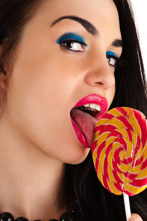 beautiful sexy woman licking lollipopの写真素材