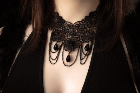 beautiful black ornament on neck of girlの写真素材