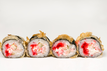 Four beautiful sushi roll with crab closeupの写真素材