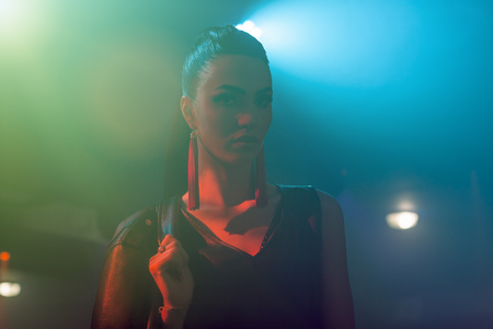 beautiful fashion brunette woman in nightclubの写真素材