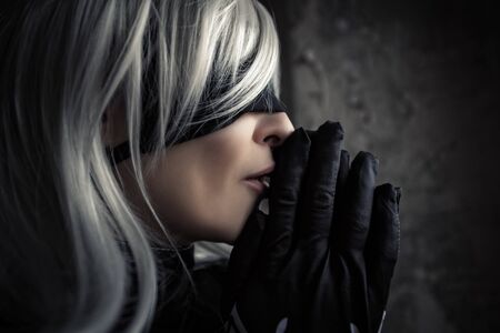 profile face woman in white wig and black blindfold, cosplayの写真素材