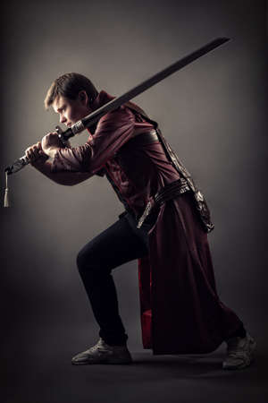 brutal samurai with sword in handsの写真素材