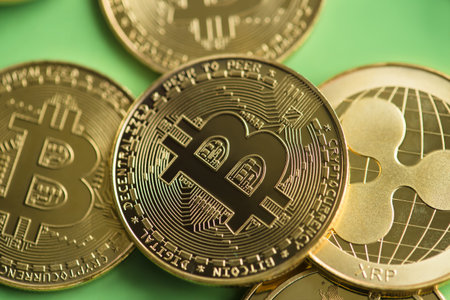 crypto currency bitcoin and xrp closeup, view from above