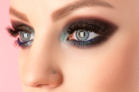 beautiful woman eyes closeup with black makeupの写真素材