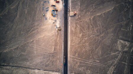 Aerial top down view on "the Tree" and "Lizard" of the Nazca lines known as an UNESCO World Heritage Site. Mysterious lines and geoglyphs next to pan american highway.の写真素材