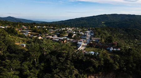 Aerial view on a small town in the mountainous tropical rainforest in Peruvian jungle, San Martin province.の写真素材