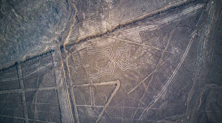 Aerial top down view on "the Spider" one of the Nazca lines known as an UNESCO World Heritage Site. Mysterious lines and geoglyphs at the Nazca desert.のeditorial素材