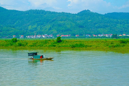 Fishing boat on the riverの写真素材