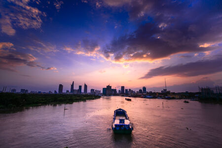 Sunset on the Saigon River with a shipの写真素材