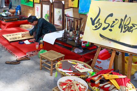 Ho Chi Minh City Vietnam January 20 2014: Vietnamese Lunar Year festival in calligraphy scholar at the Youth Cultural House at gi. This is a tradition of the Vietnamese lunar new yearのeditorial素材