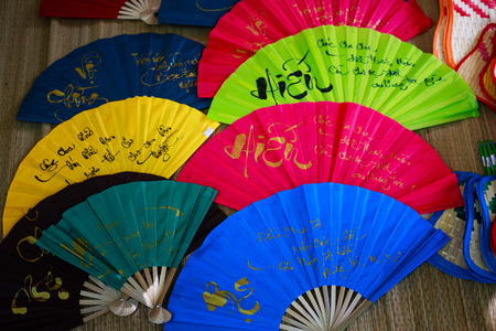 Vietnam Ho Chi Minh city May 28 2015: the colorful paper fans in a shop at the fair in downtown Ho Chi Minh City is a typical paper fan cultural features of Vietnam as well as the Asian ngi regionのeditorial素材