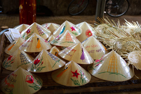 Vietnam Ho Chi Minh city May 28 2015: the conical hat was painted colorful leaves in a shop at the fair in downtown Ho Chi Minh conical hat is a culture bit by ngi Vietnamのeditorial素材