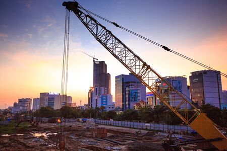 Hochiminh City Vietnam June 3 2014: the construction Workers steel and beton pier for metro lines crossingのeditorial素材