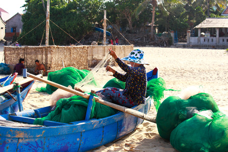 Lagi beach, Vietnam - August 16, 2015: the daily work of ngi fishing village Lagi, BinhThuan province, Vietnamのeditorial素材
