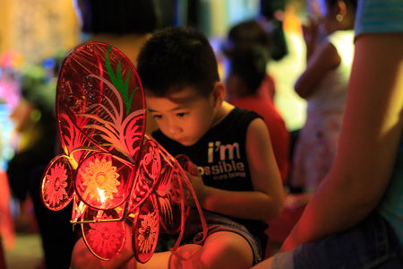 Hochiminh City, Vietnam - September 26, 2015: Children are happy to attend mid-autumn festival at a residential building in the city of HoChiMinh. Mid-Autumn Festival is a celebration of the full moon in August every year in Vietnamのeditorial素材