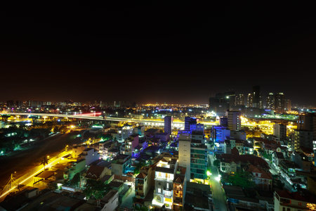 HoChiMinh city, Vietnam - February 8, 2016 : A view of Ho Chi Minh city from above at night with the skyscrapers and Saigon Riverのeditorial素材