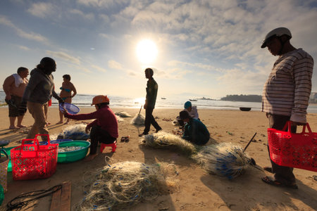 Nha Trang city, Vietnam - January 29, 2016 : Crowed atmosphere at outdoor seafood market on beach, views selling fresh fish right on the beach by the fishermen in the city NhaTrang, Vietnamのeditorial素材