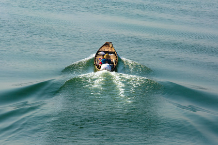 Tri An Lake, Dong Nai Province, Vietnam - March 6, 2016: A fisherman's and his son on his boat on Tri An Lake at the early morning. They live there at fishing village of Tri An Lakeのeditorial素材