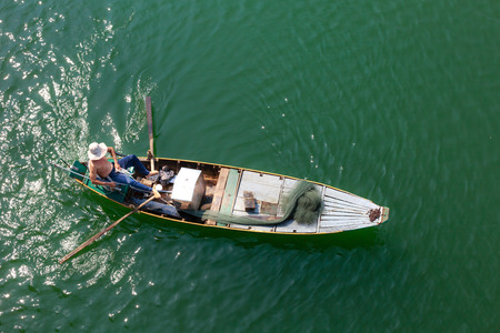 Tri An Lake, Dong Nai Province, Vietnam - March 6, 2016: A fisherman's boat on the lake in the early morning. This is a fisherman who lives in the fishing village of Tri An Lakeのeditorial素材