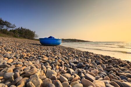 Pebbles beach and blue sky on backgroundの写真素材