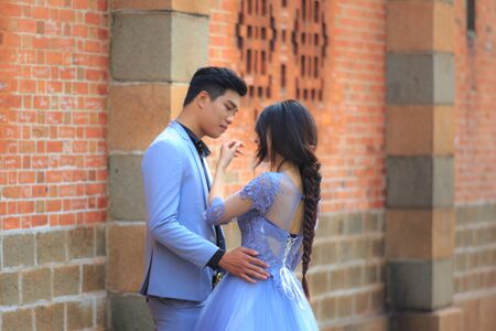 Hochiminh City, Vietnam - March 20, 2016 : Happy newlywed romantic couple have fun beside the Notre Dame Cathedral, downtown HoChiMinhのeditorial素材