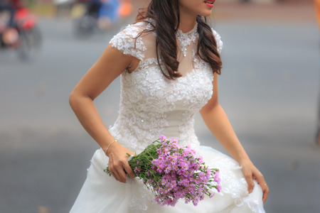 Hochiminh City, Vietnam - March 20, 2016 : wedding bouquet in hands of the brideのeditorial素材