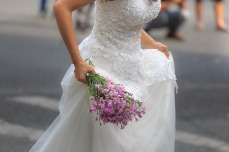Hochiminh City, Vietnam - March 20, 2016 : wedding bouquet in hands of the brideのeditorial素材