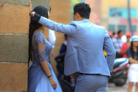 Hochiminh City, Vietnam - March 20, 2016 : Happy newlywed romantic couple have fun beside the Notre Dame Cathedral, downtown HoChiMinhのeditorial素材