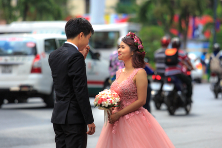 Hochiminh City, Vietnam - March 20, 2016 : Happy newlywed romantic couple have fun beside the Notre Dame Cathedral, downtown HoChiMinhのeditorial素材