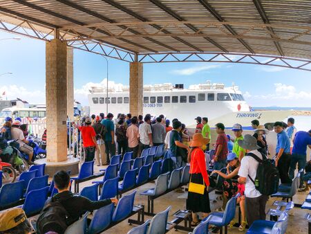 Ha Tien Town, Kien Giang province, VietNam - May 03, 2016 :  ThachThoi large ferries: passengers are queuing to get on the ferry to travel to Phu Quoc Island. The ferry transports thousands passengers daily.のeditorial素材