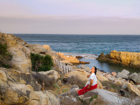 Hang Rai coast, Ninh Thuan province, VietNam - March 27, 2016 : A lady resting on the mountains near...
