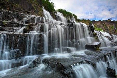 View scene  stunning waterfall in the rainforest Pongour near Da Lat city, Vietnamの写真素材