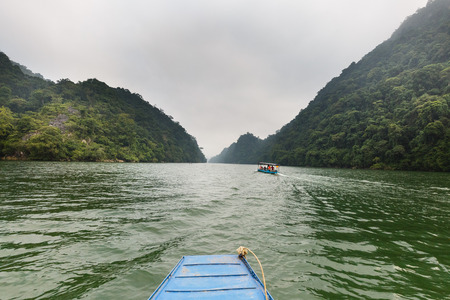 Ba Be lake, Bac Kan province, Vietnam - September 22, 2016 : tourists on the boat are going to enjoy and explore Ba Be lake. Stunning scenery of Ba Be Lake in Bac Kan Province, Vietnamのeditorial素材
