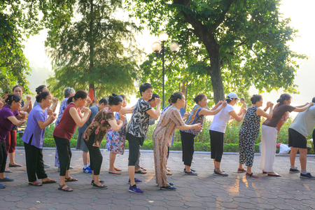 Ha Noi, Vietnam - September 20, 2016 : people is exercising at edge of the Hoan Kiem lake on a sunny morning. Hoan Kiem Lake is the center of the capital, Hanoi, morning people are excited when exercising or walking around the lakeのeditorial素材