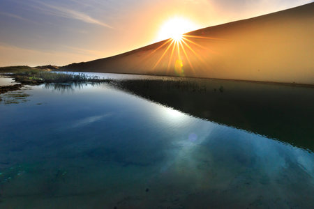 The harmony of nature, sand dunes and lakes when the sun is rising at Mui Dinh, Ninh Thuan Province, Vietnamの写真素材