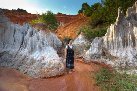 Mui Ne, Phan Thiet city, Vietnam - November 27, 2016 : Woman so excited to be walking on feet in the...