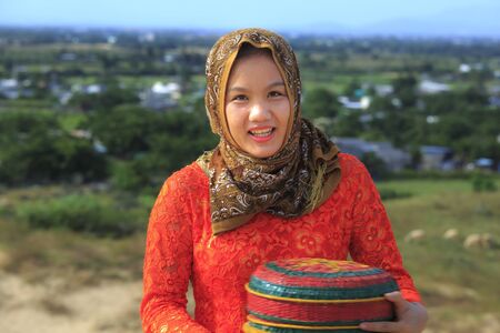 Phan Rang city, Viet Nam - December 24, 2016 : Beautiful portrait of Cham girl, minority ethnic of Vietnamese, pretty women in traditional dress on the sand dunesのeditorial素材