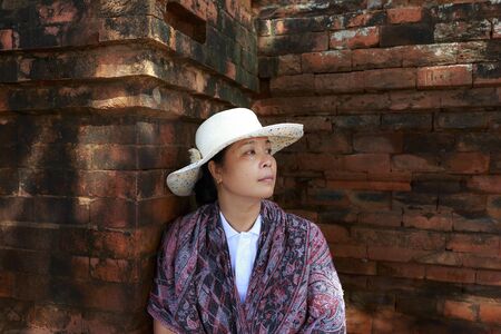 Cham tower, Phan Rang city, Viet Nam - December 25, 2016: a female tourist beside ancient wall of Cham towerのeditorial素材