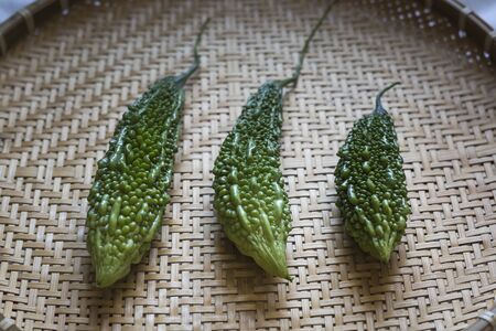 bitter melon on bamboo backgroundの写真素材